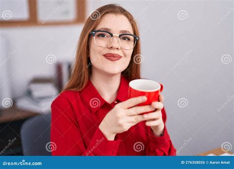 Young Redhead Woman Business Worker Smiling Confiden Drinking Coffee At
