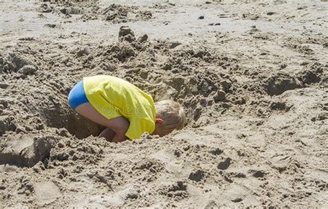 Boy Digging Hole In Sand Stock Photo Image Of Game Closeup 18970048