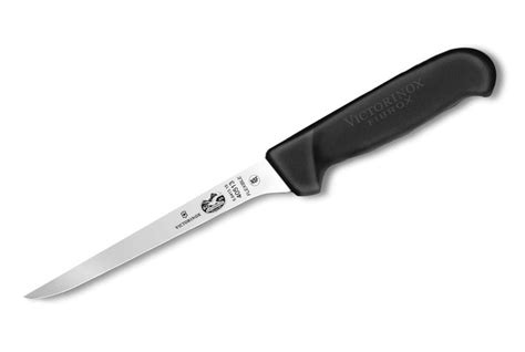 a large knife with a black handle on a white background