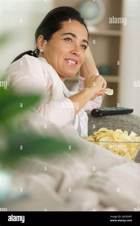 Fat Woman Watching Tv Having Excess Weight Can Affect A Persons Risk