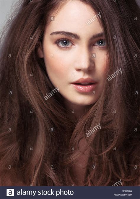 Beauty Face Portrait Of Young Woman With Long Brown Hair And Gray Eyes