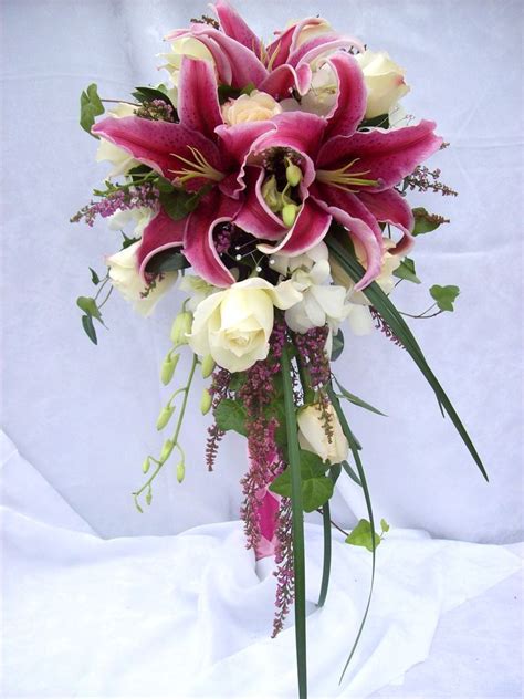 Your bouquet help help convey the style of your wedding, as well as be a great complement to your the cascade bouquet, also known as the teardrop or trail bouquet, is the most traditional and the composite bouquet is constructed using hundreds of real petals wired together to form an. Stargazer lilies and whites roses in a traditional cascade ...