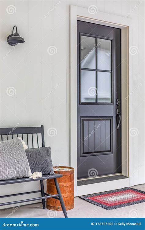 Black Front Door At Modern Farmhouse With Bench Stock Photo Image Of