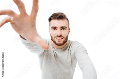 Handsome Guy Reaching Out To The Camera Isolated Young Man Trying To