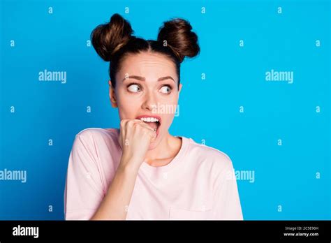Closeup Photo Of Attractive Scared Lady Two Buns Biting Teeth Fingers
