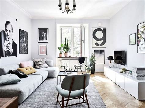 This is a small and simple minimalist living room with a sing gray sofa paired with a white coffee table that contrasts the black tiles of the floor. space-optimized-minimalist-living-room-small-apartment-2 ...