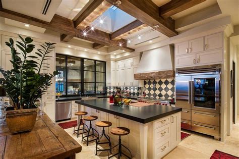 Kitchen Features A Custom Ceiling With Exposed Joists And A Skylight