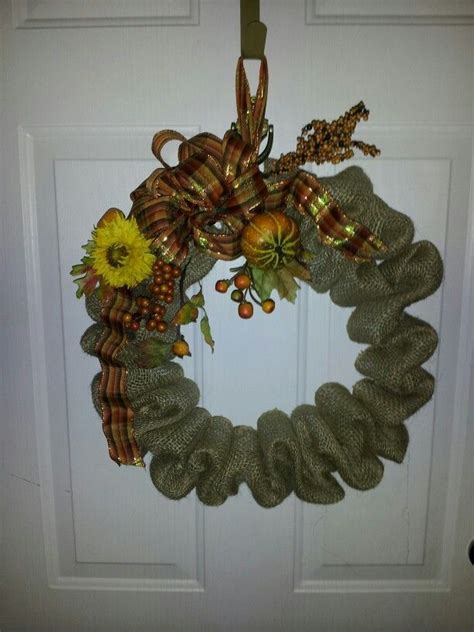 Silk flowers and leaves to embellish. Burlap Wreath with Directions to Make Coat Hanger | Pin by Amy Thompson on Wire coat hangers ...