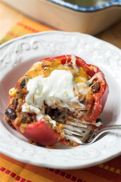 a delicious filling made with seasoned ground beef rice black beans and corn is topped with