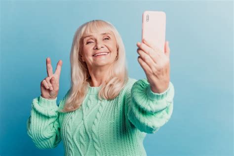 Premium Photo Pretty Grey Haired Old Woman Taking Selfie Smartphone Make V Sign Isolated Over