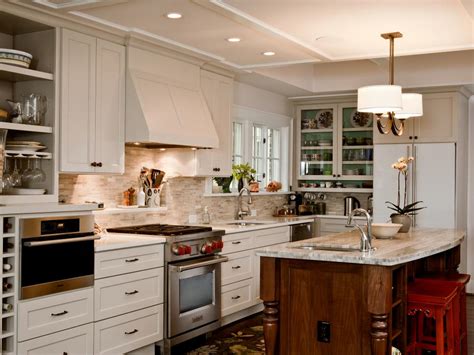 This modern kitchen by lwk kitchens london features flat front white cabinetry with a smooth and shiny lacquered finish. Traditional Kitchen With White Cabinets and Wood Island | HGTV
