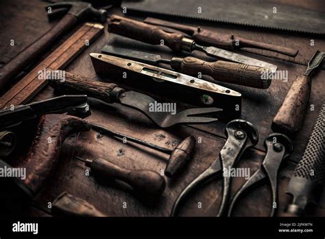 Workbench Full Of Rusty Old Carpenters Tools For A Craftsmanship