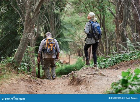 A Rear View Of Amature Caucasian Couple Out For A Hike Together Senior Man And Woman Exploring