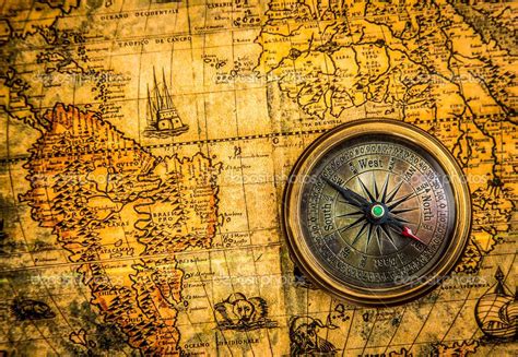 Vintage Compass Lies On An Ancient World Map Stock Image 22953922