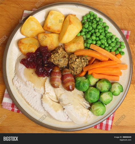 English christmas traditions and how to celebrate them in. Roast turkey Christmas dinner with traditional trimmings. Stock Photo & Stock Images | Bigstock