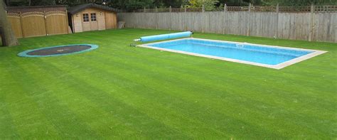 Striped Artificial Grass Turf Around A Swimming Pool Artificial Grass