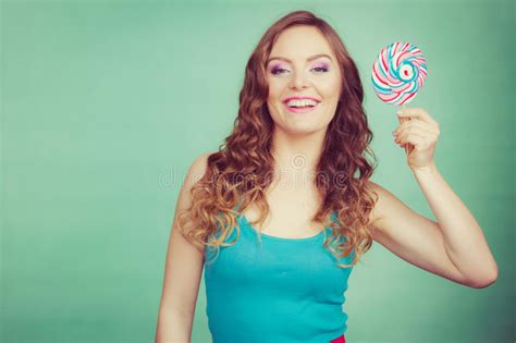 Smiling Girl With Lollipop Candy On Teal Stock Photo Image Of Model