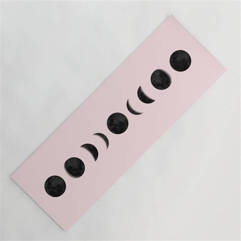 A Pink Paper With Black Phases On It