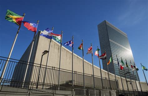 Low Angle View Of United Nations In New York With National Flags