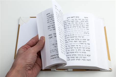 Premium Photo Leafing Through A Hebrew Prayer Book