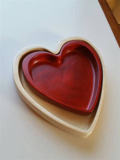 A Heart Shaped Dish Sitting On Top Of A Table