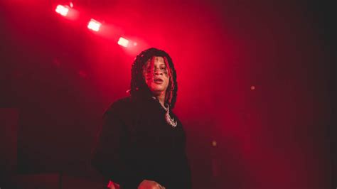 Black Red Braided Hair Trippie Redd Is Standing In Red Background