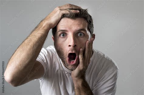 Young Attractive Man Astonished Amazed In Shock Surprise Face Expression And Shock Emotion Stock