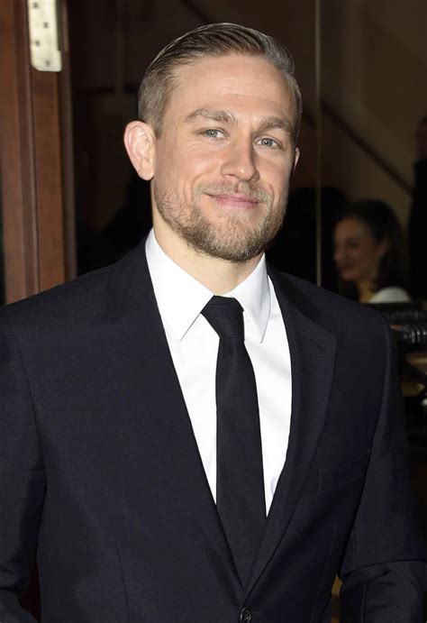 charlie hunnam is sexier than ever in a black suit at lost city of z berlin premire