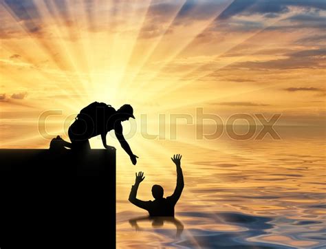 A Sinking And Saving Man Offers A Stock Image Colourbox