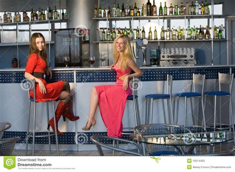 The iliac bones, the ischial (sitz) bones, and the pubis. Two Young Ladies Sitting At Bar Counter Stock Photo ...