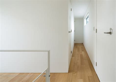 House K By Yuji Kimura Design Conceals Terraces Behind A Tall Wall