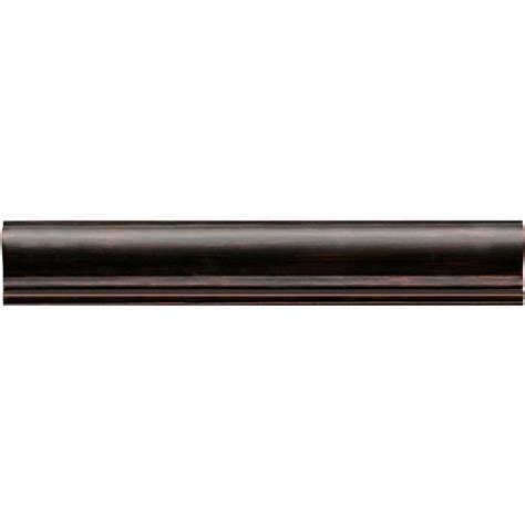 Adding a chair rail can make a sharp statement in any room. Daltile Armor - Guilded Copper Chair Rail 2" x 12"