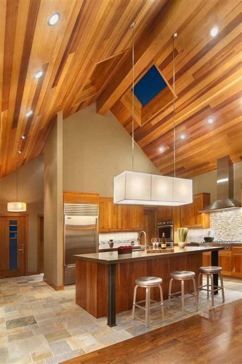 Minimal lighting is required in this vaulted ceiling kitchen with glass sky windows. Vaulted ceiling lighting ideas - creative lighting solutions