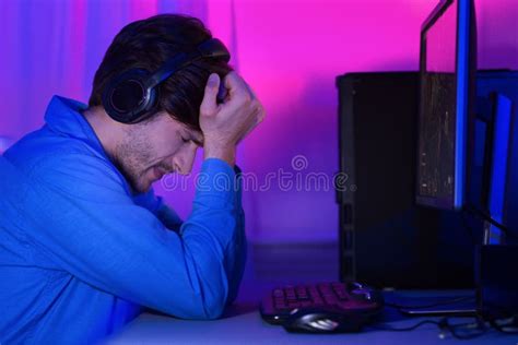 Gamer Guy Losing Computer Game Sitting Unhappy At Pc Indoor Stock Photo