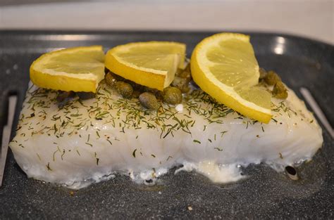 Baked Sea Bass With Capers And Lemon Recipe Baked Sea Bass Paleo Seafood Recipes Sea Bass