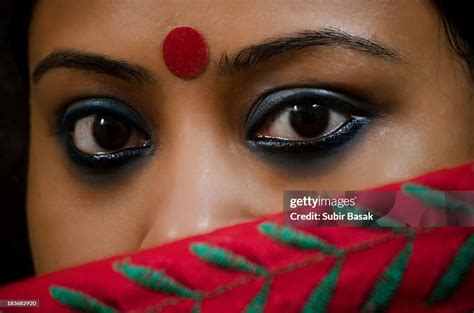Beautiful Eyes Of An Indian Woman Behind Sari High Res Stock Photo