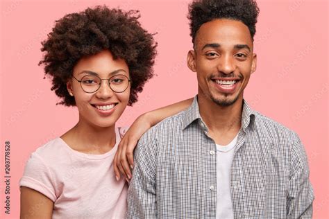 ethnicity friendship relationship concept photo of delighted female with afro hairstyle has