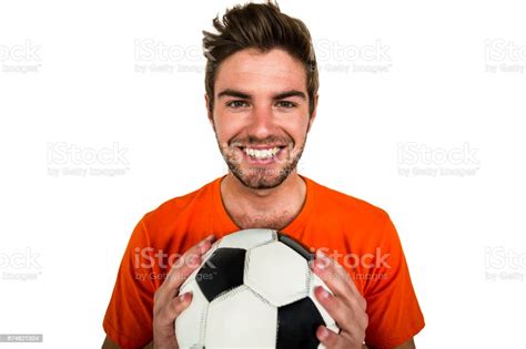 Handsome Supporter Holding Football Ball Stock Photo Download Image