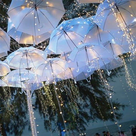 15 Surreal Ideas To Add White Umbrellas To Your Wedding Decor