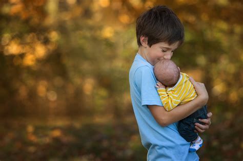 Big Brother Holding New Baby Brother Photo By Kellie Bieser Click