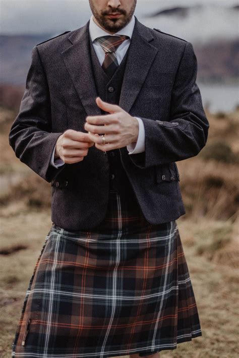 a contemporary kilt in persevere weathered brown tartan designed in edinburgh scotland crafted