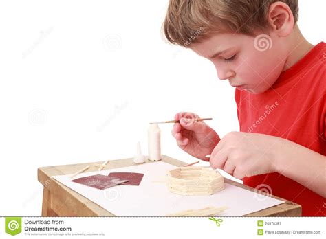 Little Boy Crafts At Small Table Side View Stock Image