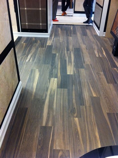 Go as dark as possible so that as it ages and darkens it won't look too obvious. Real wood floor vs. ceramic wood-look tiles?