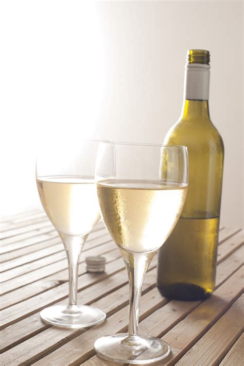 Free Stock Photo 11608 Two Glasses Of White Wine With A Bottle