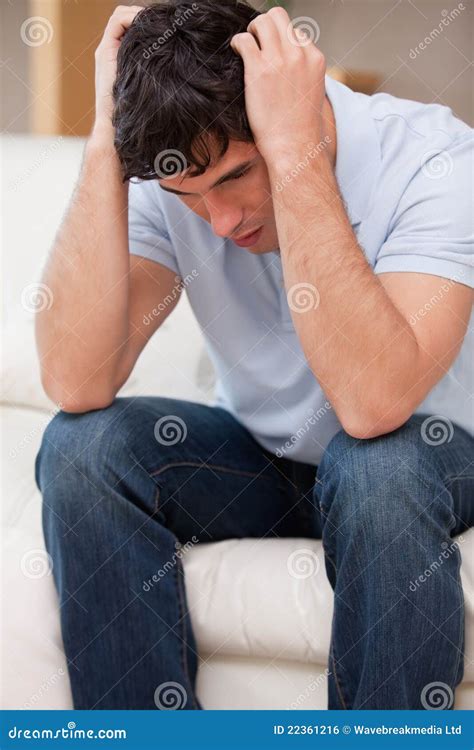Frustrated Man Sitting On The Couch Stock Photo Image Of Dramatic