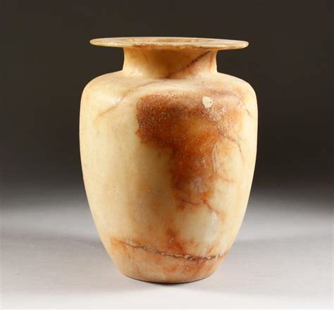 An Egyptian Alabaster Canopic Style Jar 11ins High