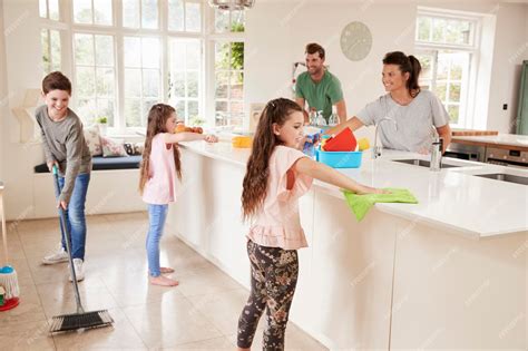 Premium Photo Children Helping Parents With Household Chores In Kitchen
