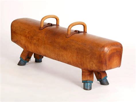 Originally made of a metal frame with a wooden body and a leather cover, modern pommel horses have a metal body covered with foam rubber and leather, with plastic handles. Vintage Gymnastic Leather Pommel Horse Bench, 1930s ...