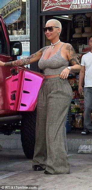 amber rose stops traffic in booty hugging trousers while hoppng into her hot pink jeep daily