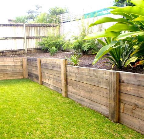 Wood Retaining Wall With Ornamental Plants Landscaping Retaining
